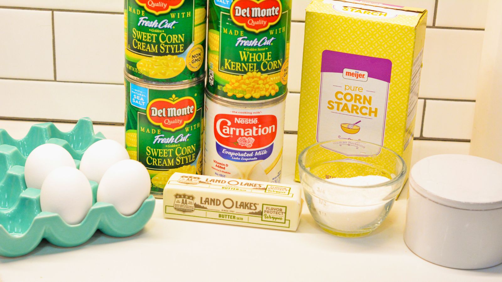 Whole Kernel Corn (canned) - 1 can, drained

Creamed Corn - 2 cans

Butter - ½ cup, melted

Eggs - 4 large, beaten

Evaporated Milk - 1 cup

Cornstarch - ¼ cup (acts as the thickening agent)

Sugar - ¼ cup for a hint of sweetness (adjust to taste)

Salt and Pepper - To taste