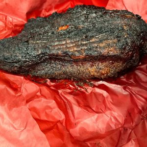 As the brisket cooks, it will hit a temperature plateau known as "the stall," usually around 160-170°F (71-77°C). This is due to evaporative cooling. Don't panic! Wrap the brisket tightly in butcher paper to power through the stall.