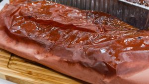 Once cooked, wrap the brisket in aluminum foil or place in an aluminum pan. Place it in a cooler and let it rest for at least 1 hour.