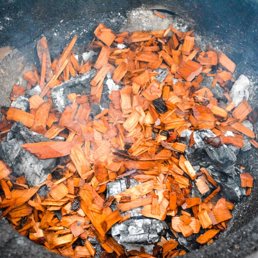 Preparing the Big Green Egg - Set up your BGE for indirect cooking using the plate setter (legs up). Aim for a consistent temperature of 250°F (121°C). Add your chosen wood chunks to the charcoal for smoky flavor.