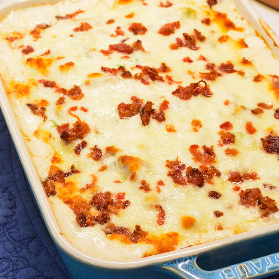 Tender ravioli, savory chicken, crispy bacon, and a luscious ranch sauce make this Chicken Bacon Ranch Casserole irresistible! 