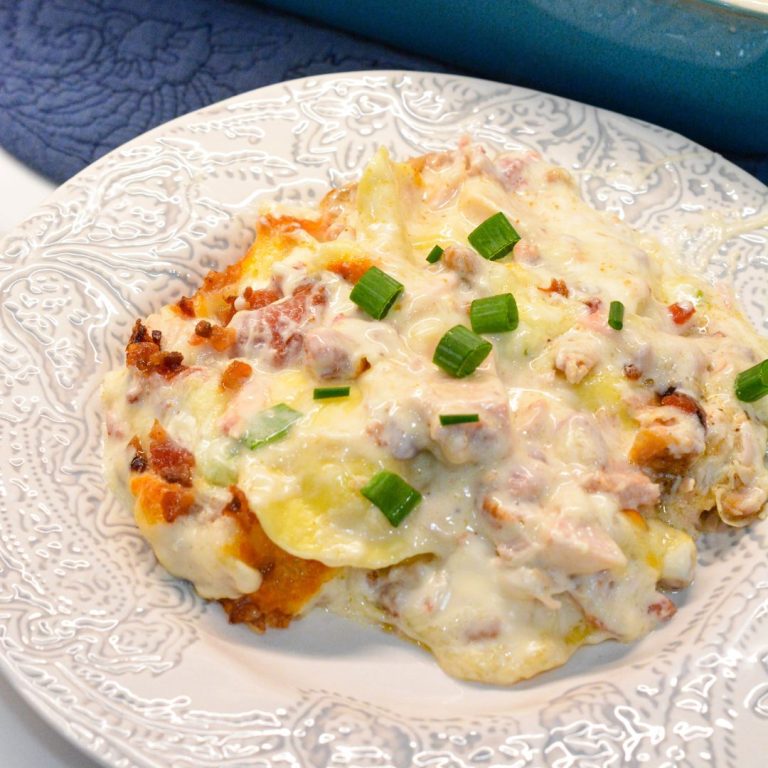 Indulge in creamy, cheesy goodness with this Chicken Bacon Ranch Ravioli Bake. Tender ravioli, savory chicken, crispy bacon, and a rich ranch sauce make this dish irresistible. Easy recipe, perfect for any occasion!