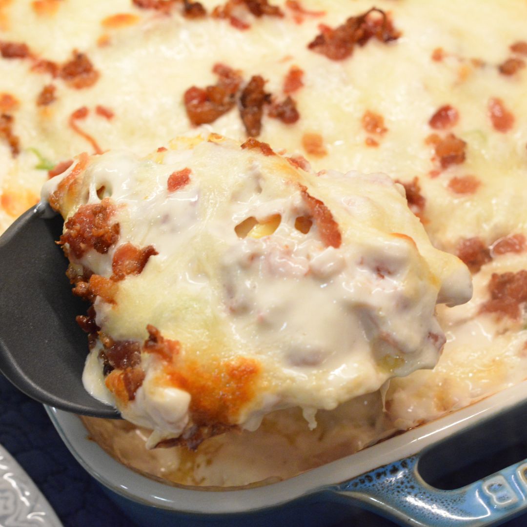 Indulge in creamy, cheesy goodness with this Chicken Bacon Ranch Ravioli Bake. Tender ravioli, savory chicken, crispy bacon, and a rich ranch sauce make this dish irresistible. Easy recipe, perfect for any occasion!