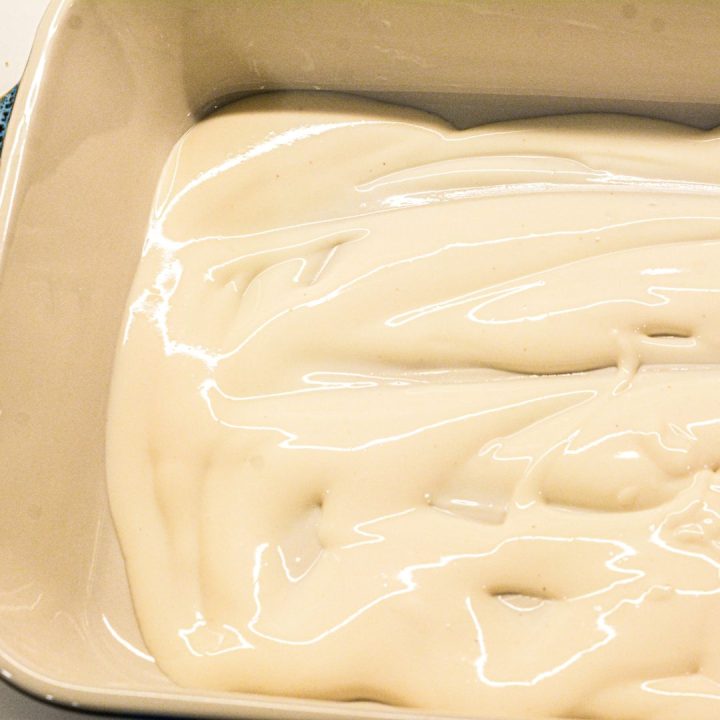 Pour a third of the sauce into the prepared baking dish.