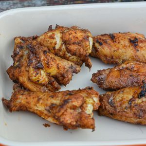 The BEST smoked chicken wings you'll ever have! 😍 Learn the baking powder secret for crackling skin and mouthwatering flavor.