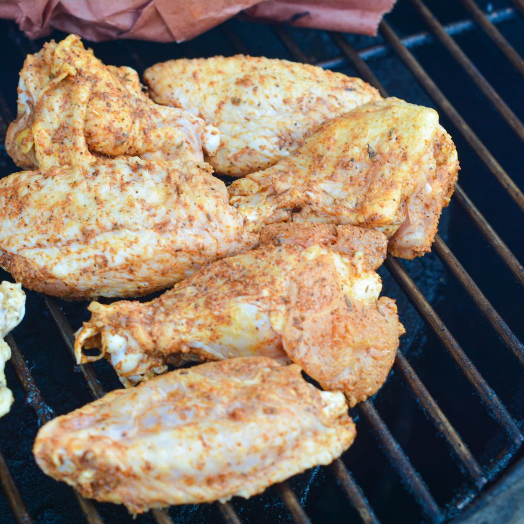 Place the wings in a single layer on the smoker grates, ensuring they're not overcrowded. 